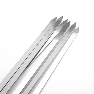 Detailed macro shot of sharp points on thick 45cm stainless steel flat barbecue skewers