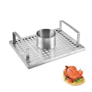 Detail of stainless steel chicken roaster rack featuring a perforated tray and sturdy handles