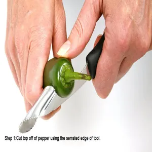 Stainless steel pepper corer tool detail view demonstrating how to easily remove seeds from vegetables.