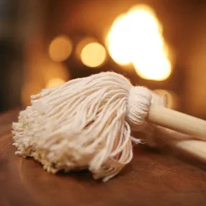 Detailed close-up showing the soft pure cotton mop head of a BBQ oil brush with wood handle