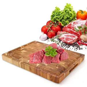 Large square acacia wood cutting board with juice groove and spliced pattern for kitchen use