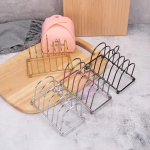 Set of four colorful stainless steel toast racks and sandwich holders for bakery display