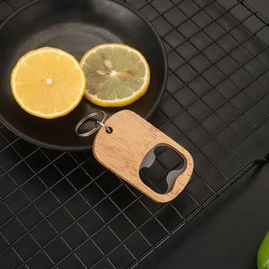 Oak wood beer bottle opener keychain with stainless steel insert on cooling rack