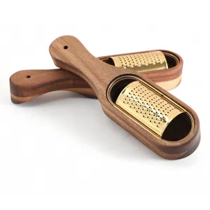 Premium titanium-plated gold cheese grater with elegant walnut-colored wood box