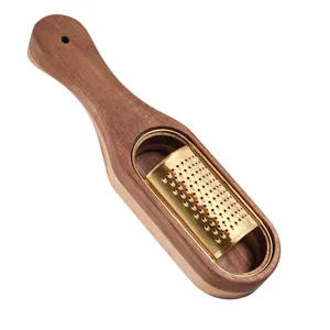 Elegant wooden cheese grater with titanium gold stainless steel blade on white background