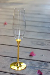 Detailed view of the elegant gold-plated stem with rhinestones on a champagne flute