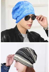 Close-up of stylish tie-dye blue and striped cotton slouchy beanies for men and women.