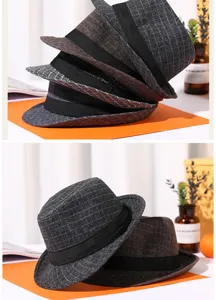 Detailed macro view showing the texture and colors of vintage plaid fedora hats for men.