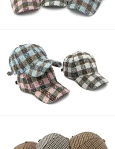 Detailed view of various tweed plaid and houndstooth patterns on baseball caps for sun protection