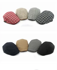 Detailed view of knitted and plaid winter flat caps in various retro colors.