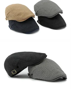 Detailed view of knitted plaid beret hats in various colors with vintage metal buckles.