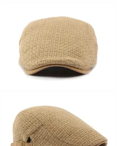 Close-up of the knitted texture and side buckle on a vintage brown flat cap.