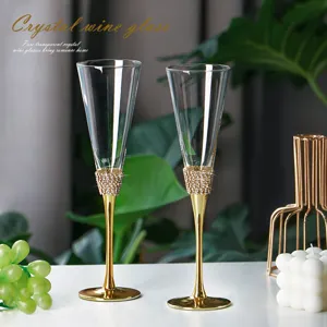 Elegant crystal champagne glasses with gold rhinestone stems in set of two