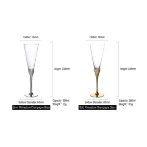 Set of two elegant champagne flutes with gold and silver rhinestone decorated stems.