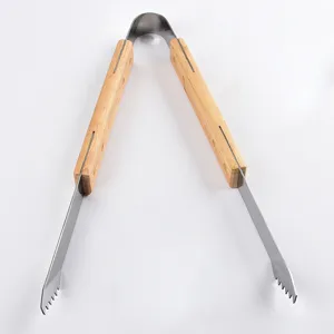 Detailed view of heavy-duty stainless steel BBQ tongs with oak wooden handles