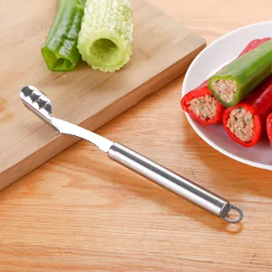 Stainless steel pepper corer detail showing serrated blade and hollowed vegetable use.