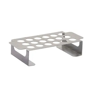 Detailed perspective of the 18-hole stainless steel BBQ grill rack for peppers and chicken legs