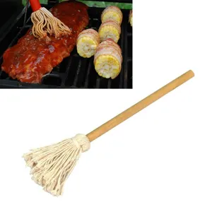 Detailed view of professional BBQ cotton mop brush with durable natural wooden handle