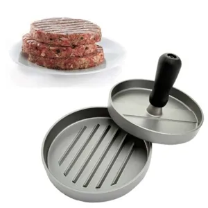 Macro detail of round non-stick hamburger patty press mold with grilled meat patties