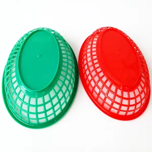 Bottom view of red and green oval plastic lattice baskets for fast food service