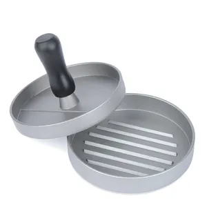 Detail of a round manual burger patty press mold showing the internal ribbed texture