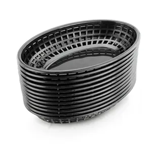 Stack of black oval plastic mesh baskets for serving fast food or organizing desktop items