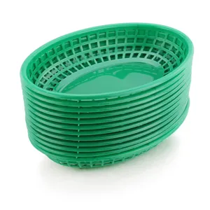 Stack of green oval plastic mesh trays for fast food service and storage