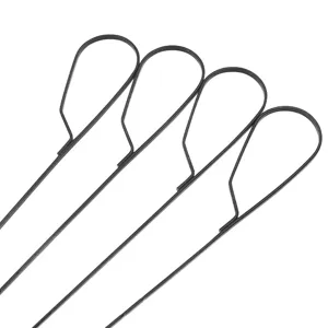 Macro close-up detail of black non-stick BBQ skewers with teardrop loop handles