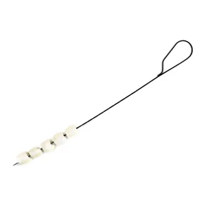 Detail of professional 61cm non-stick black BBQ skewer with marshmallows for grilling