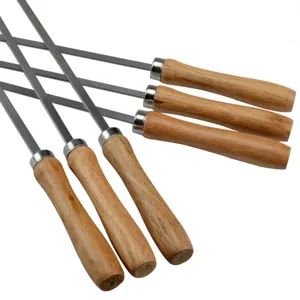 Close-up of the ergonomic wooden handles and flat stainless steel blades of BBQ skewers