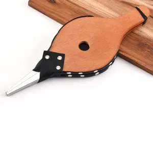 Detail of wooden hand bellows with black leather and silver studs for BBQ camping