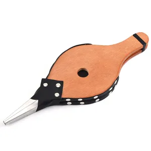 Detailed view of wooden manual fireplace bellows with metal nozzle for BBQ camping