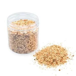 Detailed close-up of premium fine-cut fruitwood smoking chips for gourmet BBQ food smoking