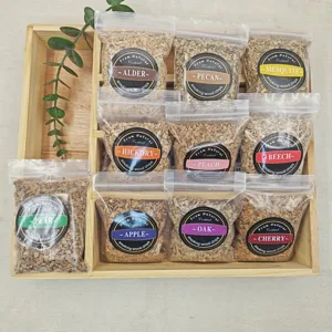 Close-up of ten bags of natural smoking wood chips in various flavors for cocktails