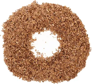 Overhead view of fine natural wood chips arranged in a circle for cocktail smoking