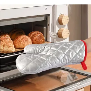 Silver quilted heat-resistant oven mitt with red trim and hanging loop for kitchen baking