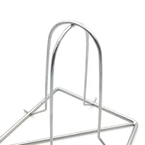Macro detail shot of a stainless steel foldable chicken roaster rack for outdoor BBQ