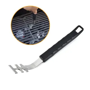 Detail view of stainless steel BBQ grill grate lifter with heat-resistant handle.