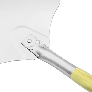 Close-up of the rivet connection and oak handle of a professional aluminum pizza peel