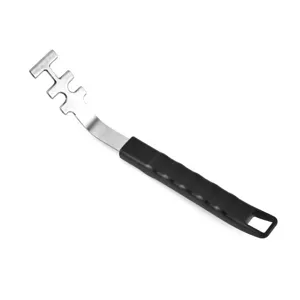 Close-up of stainless steel BBQ grill grate lifter with black anti-scald handle