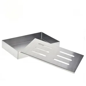 Detailed view of stainless steel BBQ smoker box showing slotted lid and metal texture