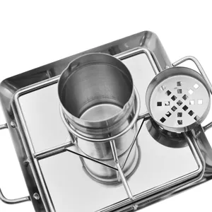 Macro view of stainless steel beer can chicken roaster rack with BBQ roasting tray