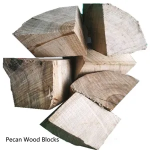 Close-up detail of natural hickory wood chunks for professional BBQ meat smoking