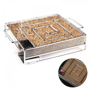 Detail view of square stainless steel cold smoke generator with sawdust for BBQ smoking