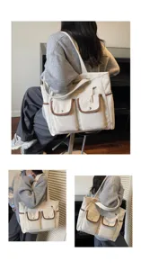 Large white corduroy tote bag for women featuring multiple front pockets and brown trim
