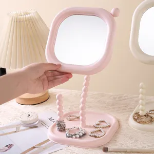 Pink desktop makeup mirror with jewelry storage tray and cute beaded stand