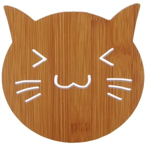 Cute cat-shaped bamboo coaster with hollow heat-resistant design for kitchen tabletop decor.