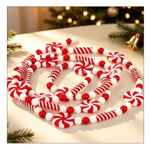 Detail of festive red and white peppermint candy bead garland for Christmas decor