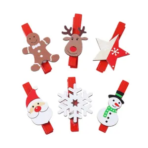 Set of 6 Christmas cartoon wooden clips for photo display and festive holiday decoration.