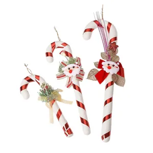 Lot de trois ornements de cannes à sucre de Noël rayées rouge et blanc avec tête de Père Noël